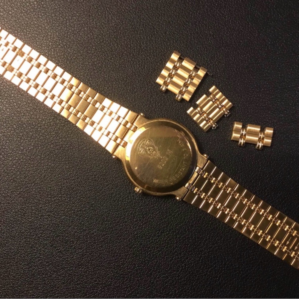 Gucci Gold Bracelet Watch with Extra Links. Comes with box and have papers.